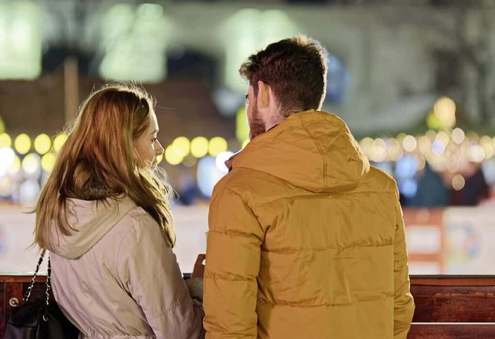 merry christmas, couple, young people, people, blonde, friendship, together, talking, fence, winter, holiday, lights, ornaments, decoration, back view, snapshot