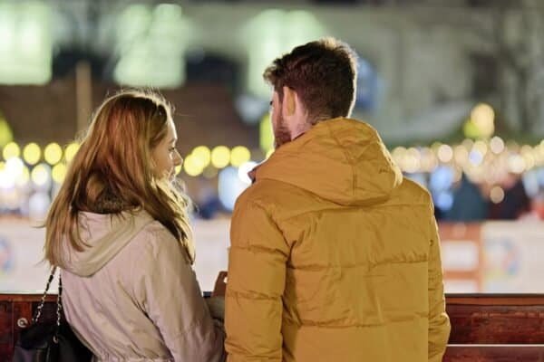 merry christmas, couple, young people, people, blonde, friendship, together, talking, fence, winter, holiday, lights, ornaments, decoration, back view, snapshot